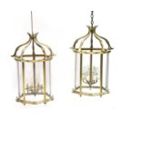 A pair of serpentine form hall lanterns,