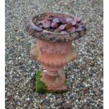 Faux terracotta garden urn,