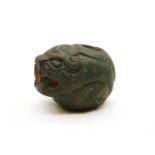 A carved stone jaguar's head,