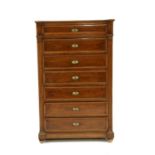 A mahogany and walnut seven drawer chest,