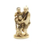 A small late 19th century Japanese carved sectional ivory group of a father and his children,