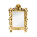 A Venetian style carved and gilt wall mirror