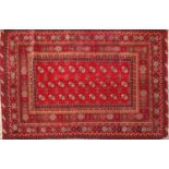 A hand knotted Bokhara rug,
