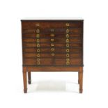 A mahogany campaign style collectors chest on stand