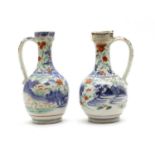 A pair of Arita ewers,