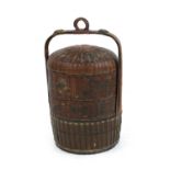 A Chinese cylindrical multi layer rice box with loop handle,