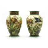 A pair of Doulton Lambeth faience vases of baluster form,