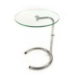 An Eileen Gray style glass and chrome side table,
