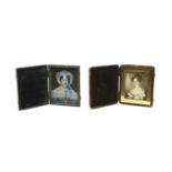 A Victorian cased portrait miniature of a young woman with tied up curly hair,