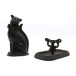 A Victorian cast iron boot scraper and a Cat door stop (2)