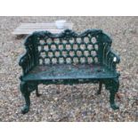 A green painted cast iron ‘horseshoe’ garden bench,