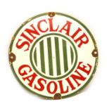 An enamel sign 'Sinclair Gasoline',