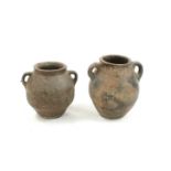 A pair of stoneware twin handled urns,