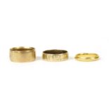 Three gold wedding rings,