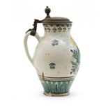 A Northern European 18th century tin glazed lidded tankard