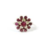 A 9ct white gold ruby and diamond cluster ring,