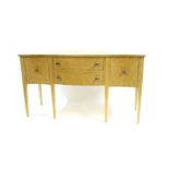 An Arthur Brett burr maple Serpentine sideboard,