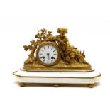 A Victorian gilt bronze and marble mantel clock