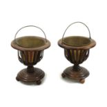 A pair of 20th century inlaid mahogany baskets,