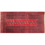 A Bokhara rug with red fields,