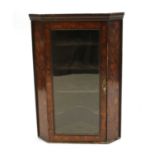 A 19th century inlaid corner cabinet,