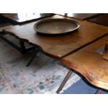 A modern cross-framed steel based centre table having shaped figured thick oak top, approx. 114cm