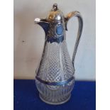 A fine 19th century silver-mounted baluster-shaped cut-glass claret jug; the thumbpiece as bushels