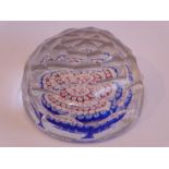 An interesting 19th century multi-faceted paperweight with red, green and blue millefiori-style