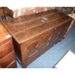 A late 17th/early 18th century oak mule chest, the thumbnail-moulded hinged lid above a four-