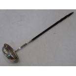 A George III period hallmarked silver toddy ladle; oval bowl and bright-cut decorated stem and