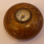 A late 19th/early 20th Century circular hardstone desk weight centrally set with a compass, 3.75cm