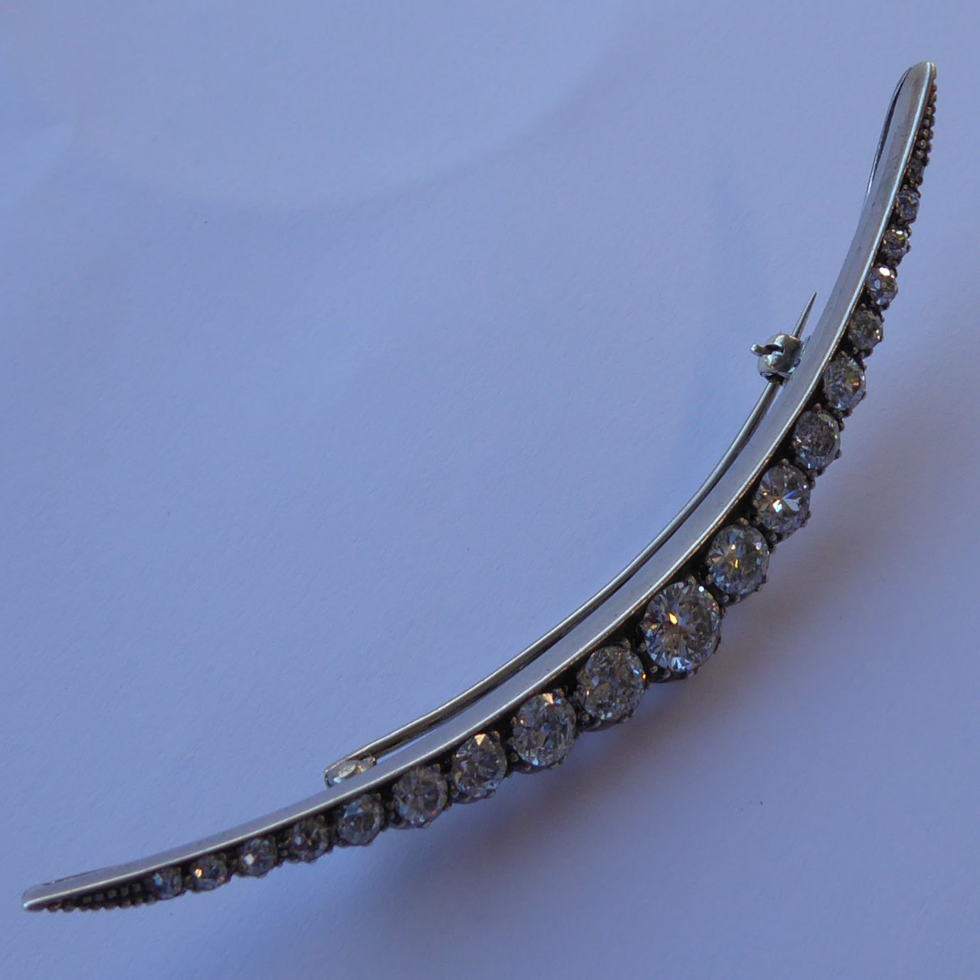 A very fine early 20th century platinum and 18-carat gold claw-set 19-stone diamond brooch of - Image 10 of 16