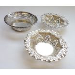 A pair of early 20th century hallmarked silver bon bon dishes with crimped edges, pierced sides