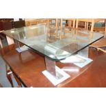 A brushed-steel and glass coffee table in the manner of Francois Monnet, France, circa 1970