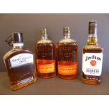 Three bottles of Kentucky and one bottle of Tennessee whiskey: 2 x Bulleit Bourbon, 1 x Jim Beam and