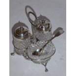 A cut glass and hallmarked silver mounted cruet set, assayed Birmingham 1858