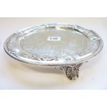 A heavy 19th century circular silver salver; pierced borders interspersed with masks in relief and