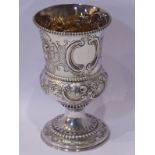 A George III period, early 19th century, heavy hallmarked silver goblet; later repoussé decorated