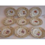 A fine set of nine late 19th century Meissen porcelain cabinet plates; each hand-gilded and with