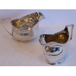 Two Georgian silver cream or milk jugs, one with bright-cut decoration