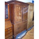 A late 18th century George III mahogany linen press; the satinwood and rosewood crossbanded