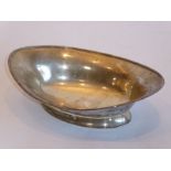 A hallmarked silver boat-shaped pedestal dish; reeded edge top above slightly spreading conforming