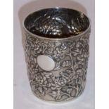 A Chinese silver cylindrical beaker decorated in high relief with chrysanthemum etc., vacant