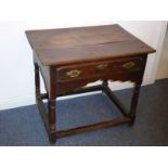 An early 18th century elm side table, the figured overhanging top above a single full-width drawer