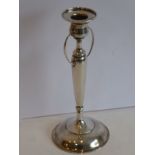 An Arts and Crafts style 925 standard silver candlestick (weighted and 21cms high)