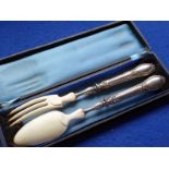 A pair of 19th century French silver-handled and ivory servers in their original case