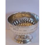 An early 20th century hallmarked silver pedestal bowl; fluted lower body and slightly spreading