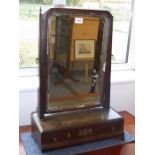 An 18th century walnut and parcel-gilt toilet mirror; three drawers and raised on ogee-style bracket