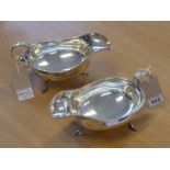 A large and fine matched pair of hallmarked silver sauce boats in Georgian style; each with