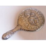 A hand held hallmarked silver ladies dressing table mirror, the lower handle and back decorated with